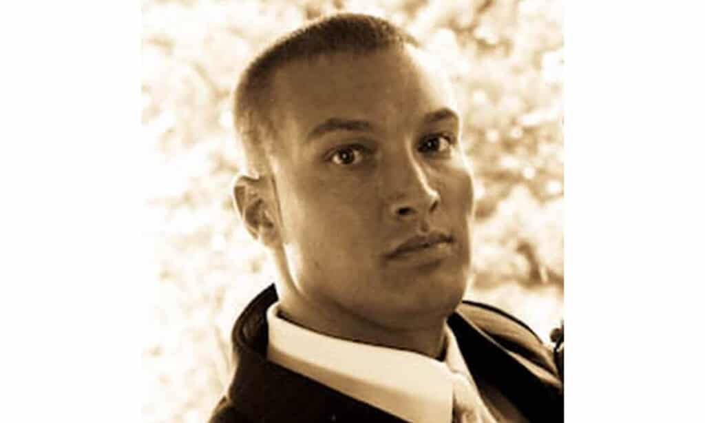 Jaramy Eugene Wilson in a dull, formal headshot lacking expression and clarity