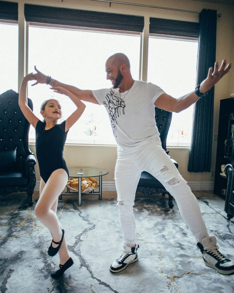 Jaramy dancing with his daughter, celebrating playfulness and personal freedom
