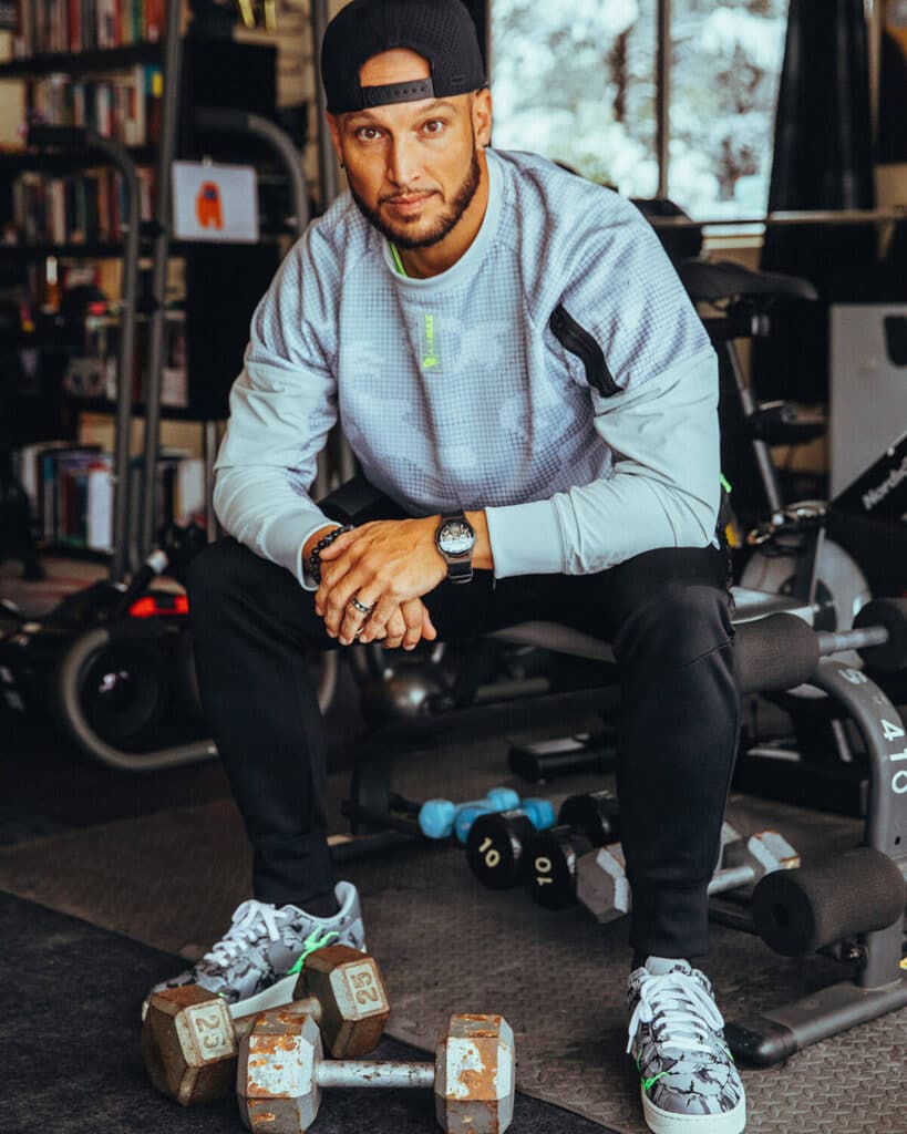 Jaramy Wilson in his gym, showing discipline and strength as a core value of his brand