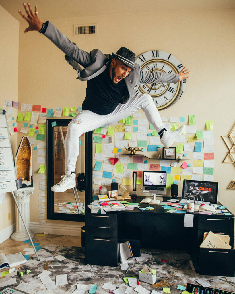 Jaramy Wilson surrounded by colorful post-it notes representing his coaching framework