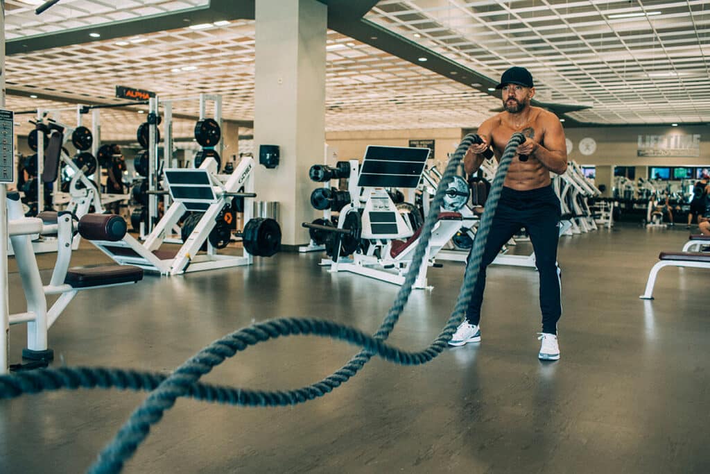 Behind-the-scenes shot of client in motion during personal brand shoot, walking confidently with natural energy