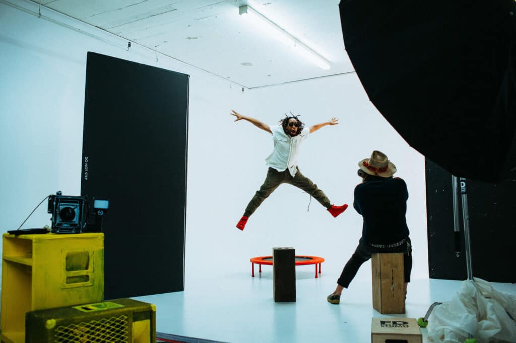 Photographer directing client during personal brand shoot to capture authentic expression