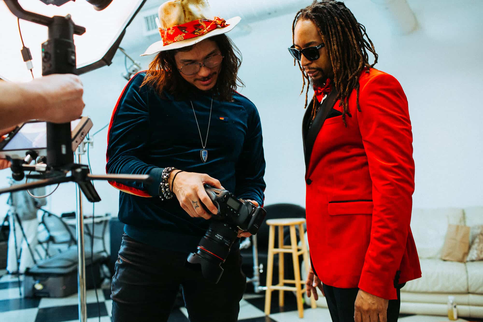 Entrepreneur reviewing photos with personal brand photographer during photoshoot