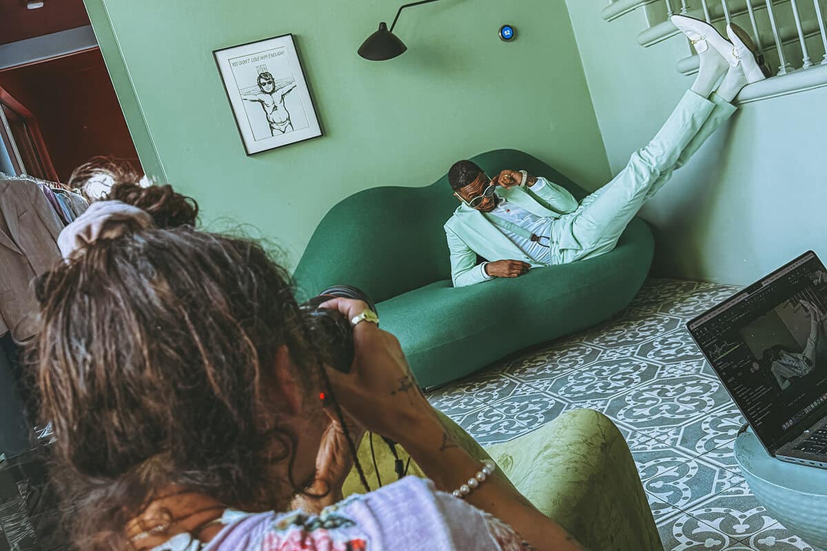 A behind-the-scenes moment from a personal brand photoshoot showing a client grounded in nature, embodying confidence and authenticity.