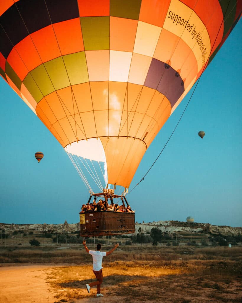 Hot air balloons rising over the Cappadocia landscape at sunrise — symbolizing Lewis Howes’ brand expansion and the elevated visual identity captured through Nick Onken’s Elevated Realism™ approach