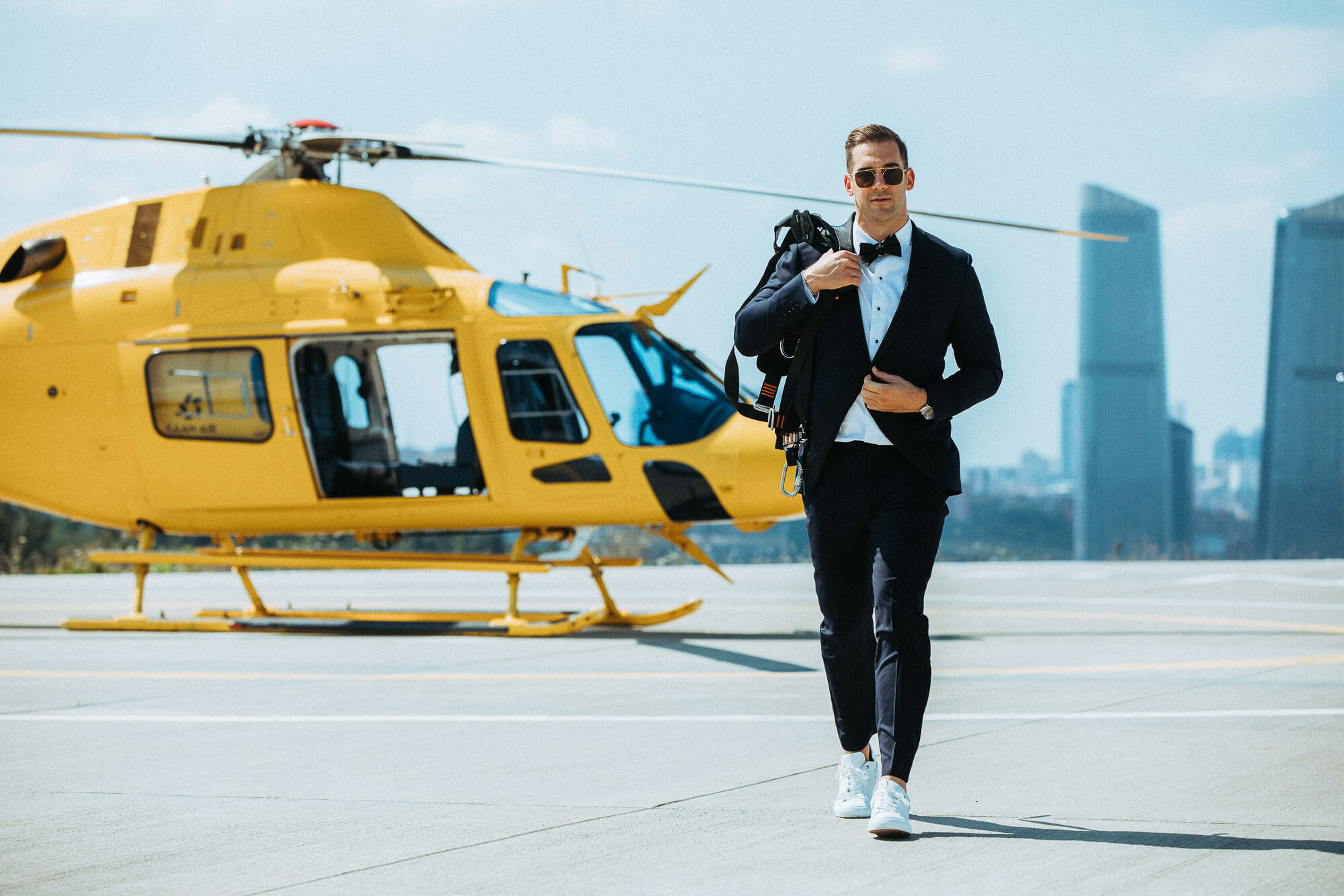 Lewis Howes standing confidently in a European location during his personal brand shoot with Nick Onken