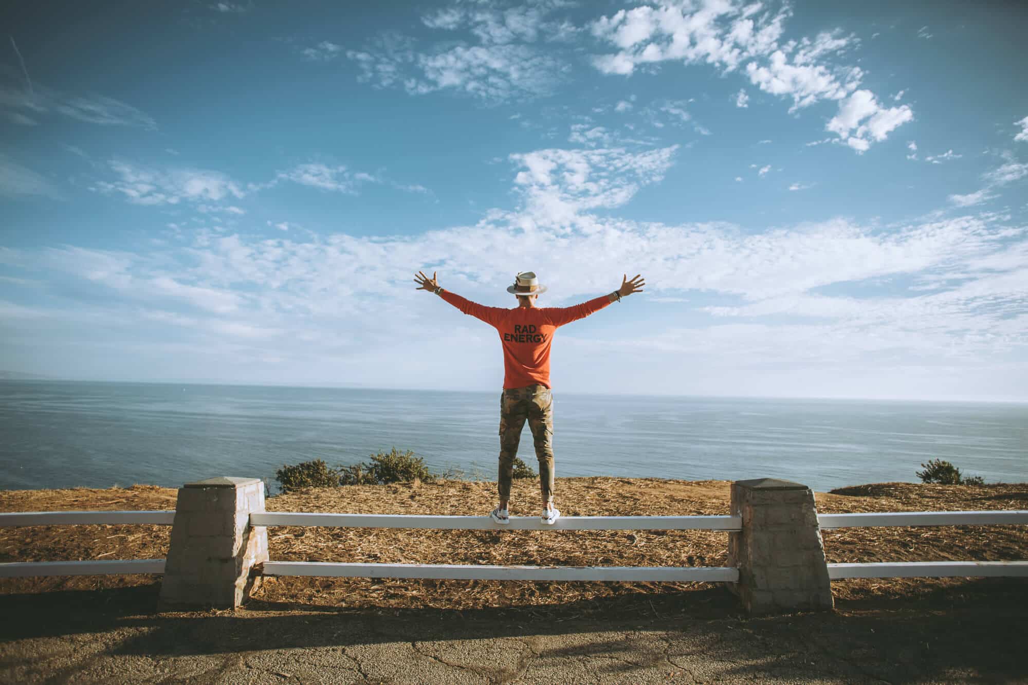 Personal brand client looking out over a vast landscape, symbolizing expansion and self-leadership through identity