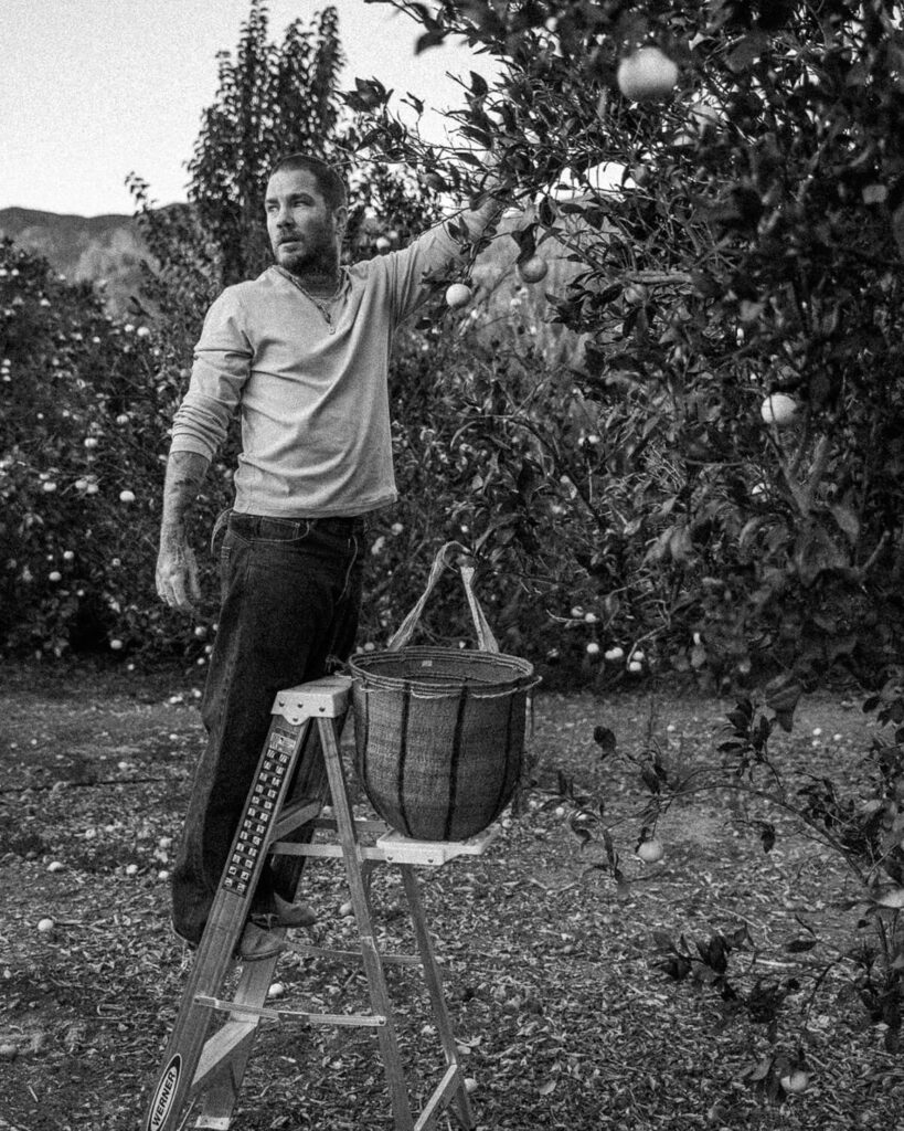 Black and white portrait of tattoo artist Balazs taken by Nick Onken outside his studio