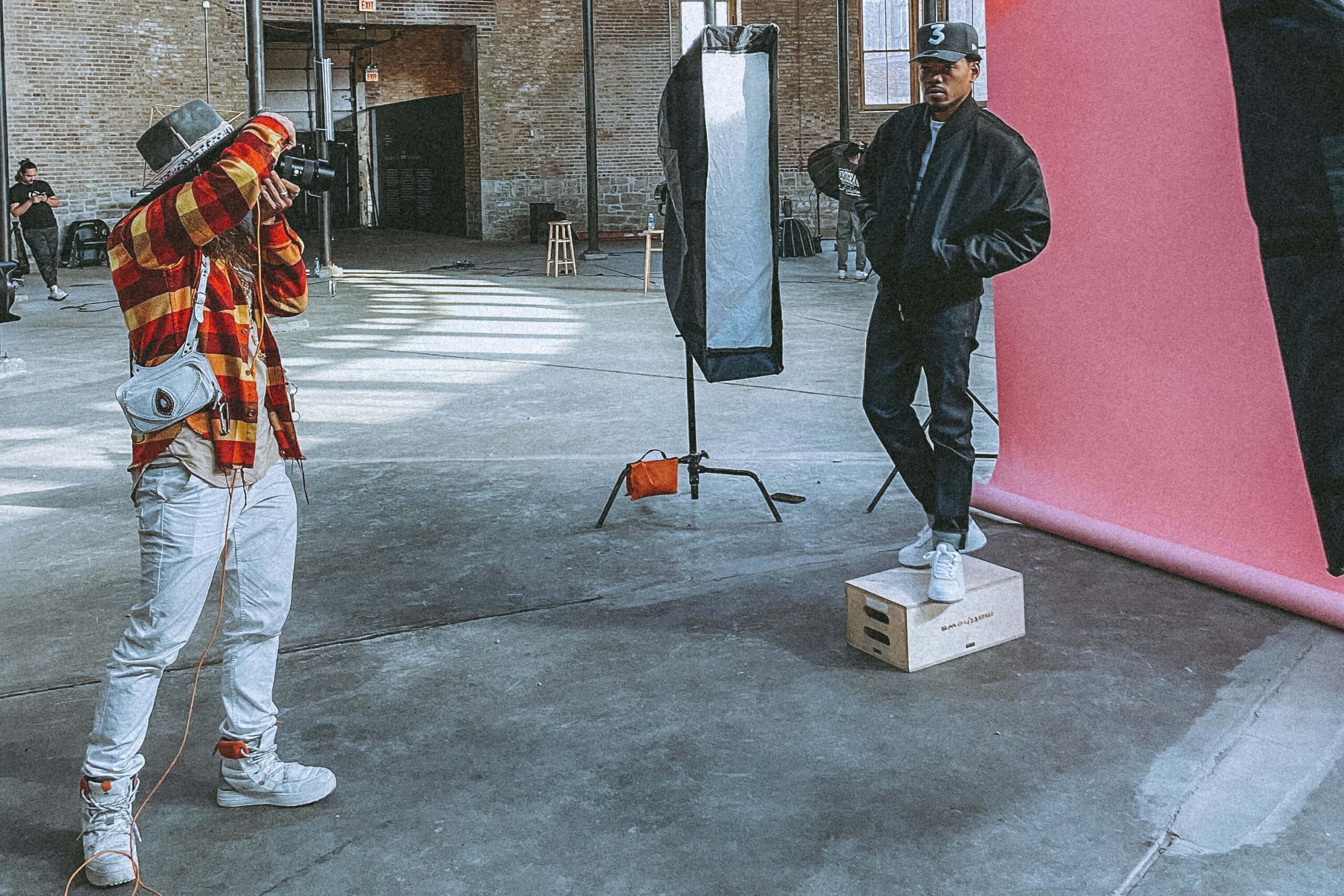 Entrepreneur being photographed in a curated natural light space, styled for brand authority and emotional presence