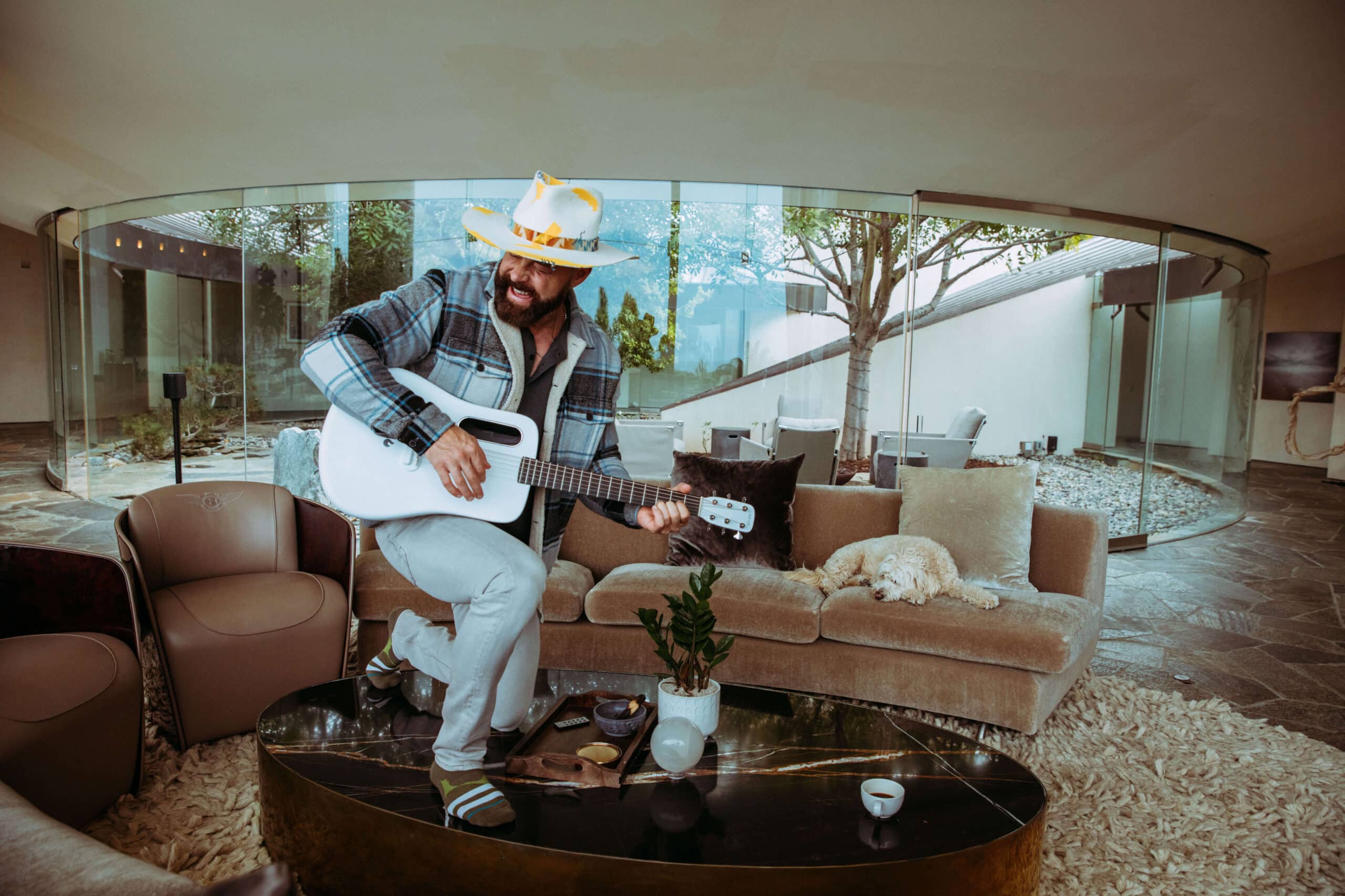 Elevated personal brand client standing in a design-forward modern home filled with natural light and styled with intention