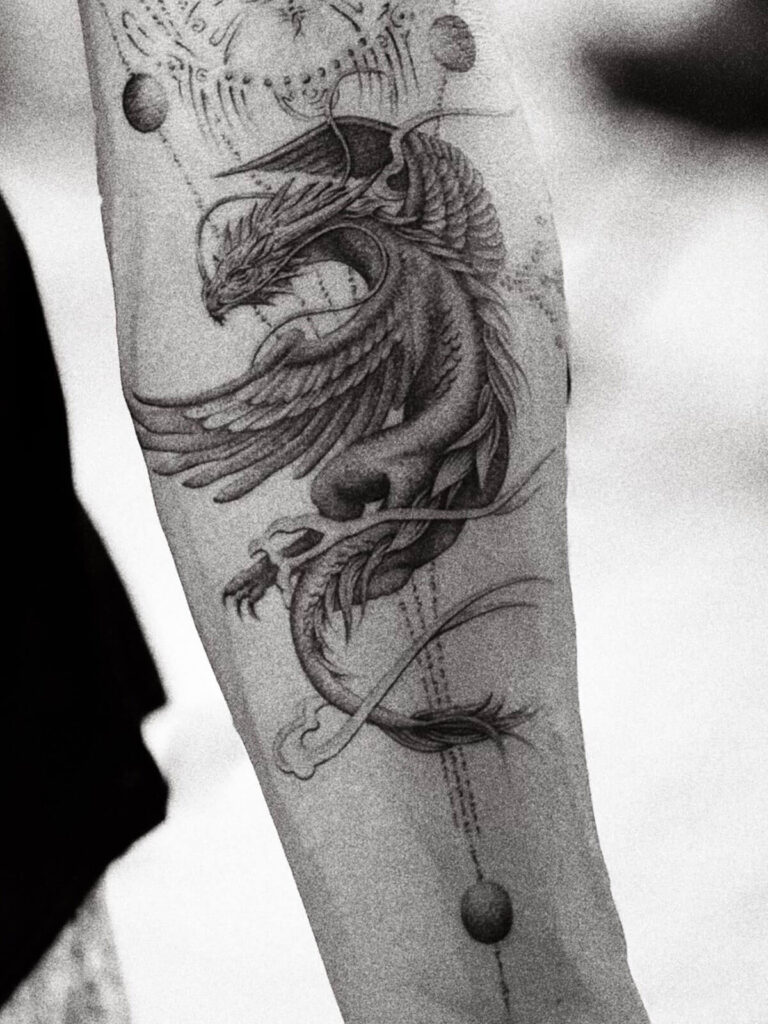 Close-up of Nick Onken’s dragon tattoo on his right arm symbolizing transformation and power