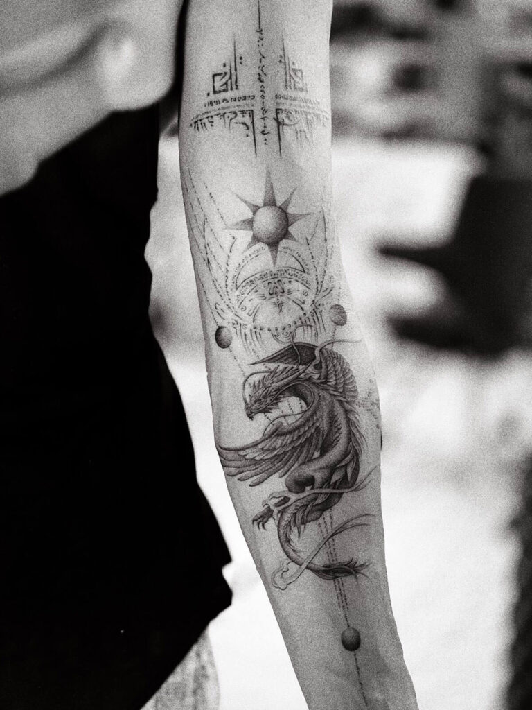 Full forearm tattoo of a flying dragon and light code geometry by Balazs, symbolizing transformation, mysticism, and personal power