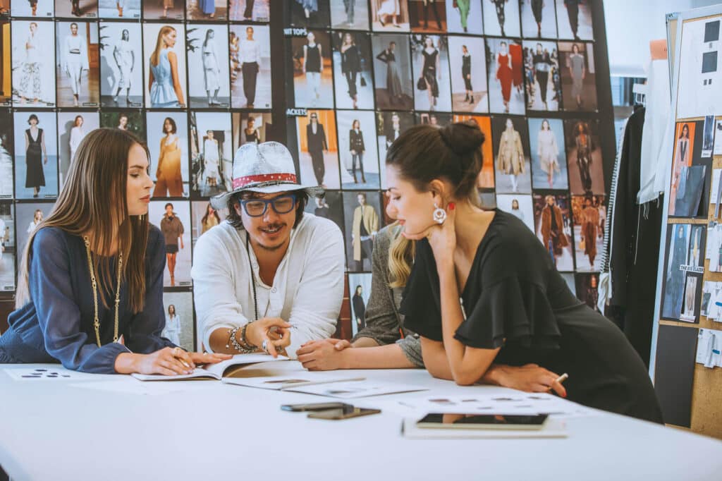 Nick Onken reviewing and refining Elevated Realism™ portfolio work while building a premium photography brand