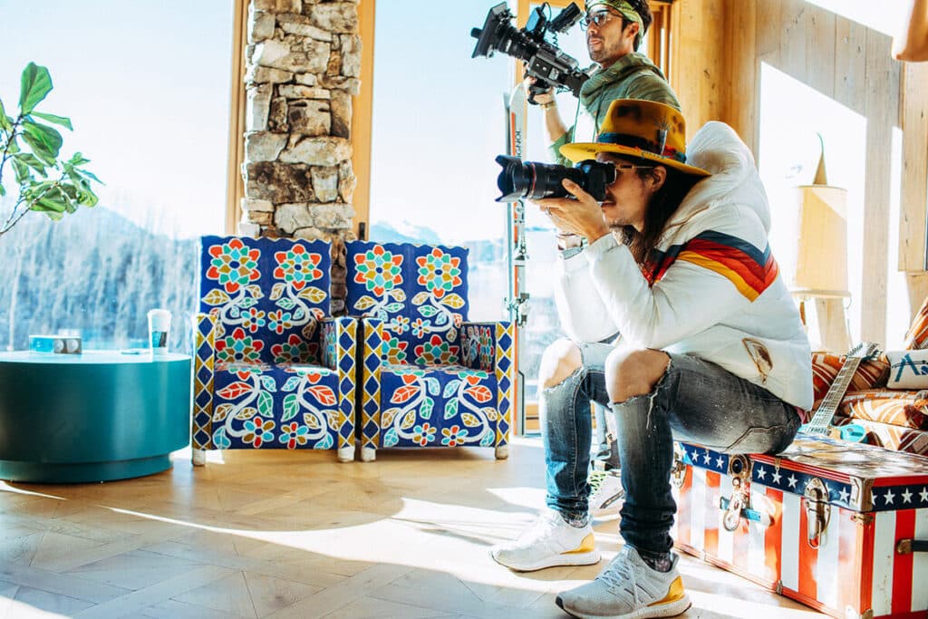 Brand photographer deeply observing client to capture authentic presence and authority