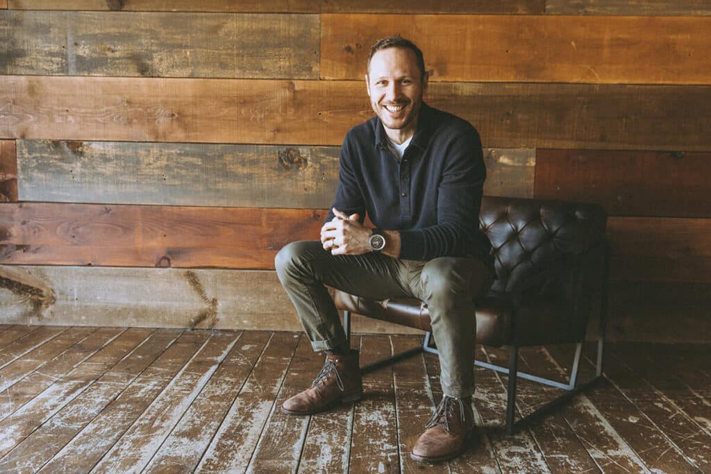 Connor Beaton speaking platform with professional photography materials