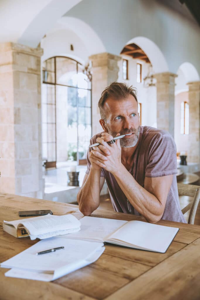 Person doing identity work through journaling to align private and public self